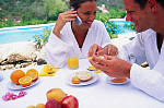 eStockPhoto Stock Photo Of Woman Eating Breakfast Outdoors
