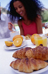 eStockPhoto Stock Photo Of Woman Eating Breakfast Outdoors