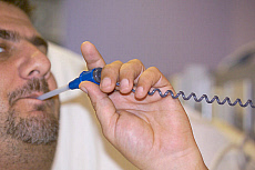Man taking temperature in the hospital.