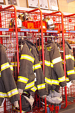 Firemens jackets hanging up.
