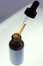 Dropper and herbal medicine bottle.