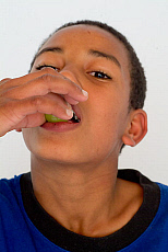 eStockPhoto Boy Hand Over Mouth Stock Photo