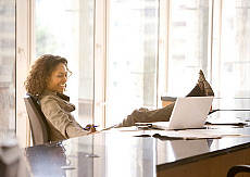 eStockPhoto Feet Under A Desk Stock Photo